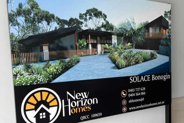 Landscape sign with image of a new house render with builder contact details and black steel legs