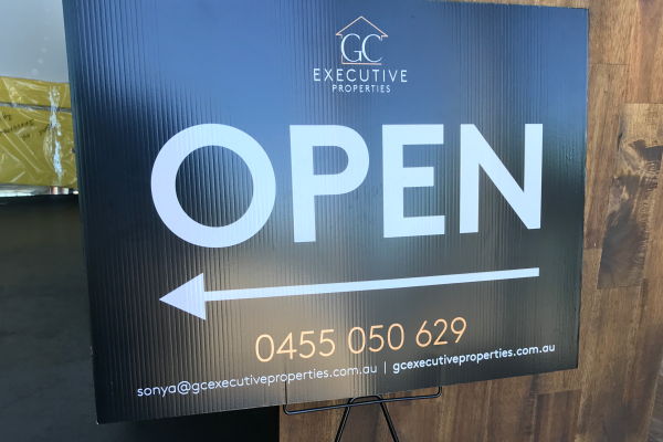 Small coreflute sign with word 'Open' and arrow for real estate signage