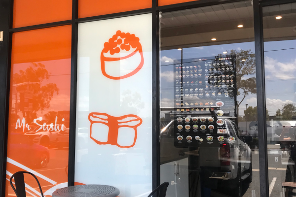 Orange and white vinyl for internal glass signage at Sushi restaurant