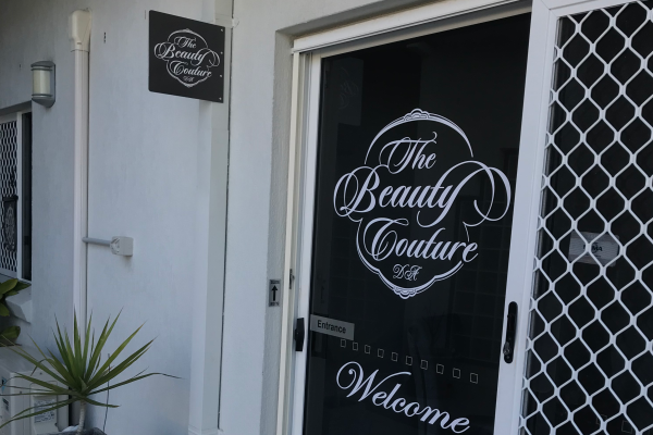 White logo cutout and installed to external glass sliding door