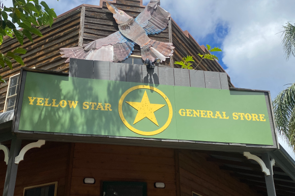 Green and yellow sign installed on front of building