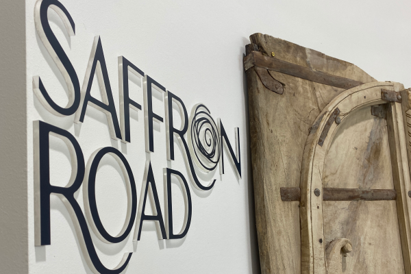 image of black 3D acrylic letters on a cream wall