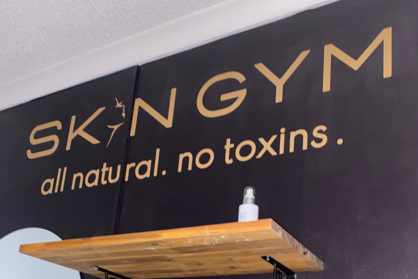 Gold text installed onto a black wall