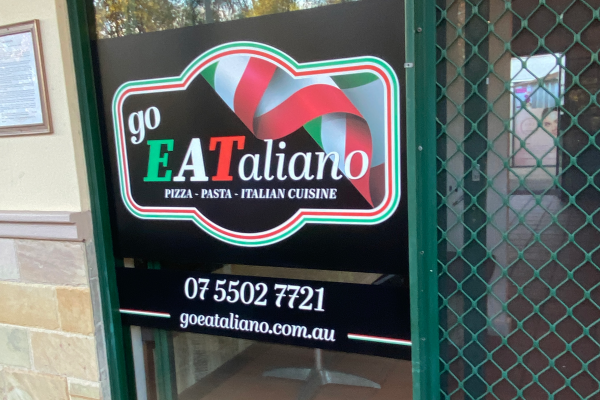 image of a window decal applied to the glass door of an Italian restaurant