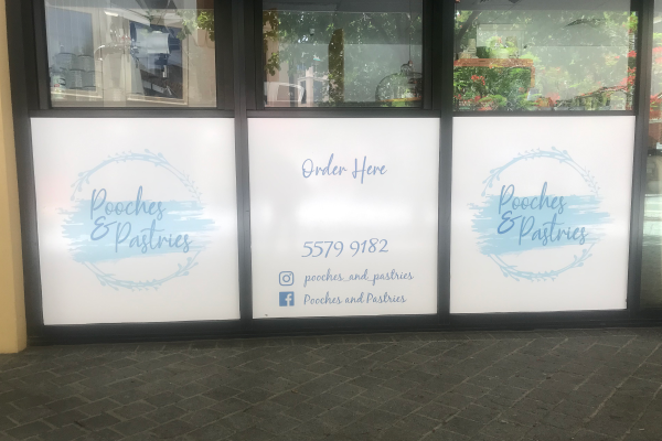 Window decals installed on the bottom of three window panes