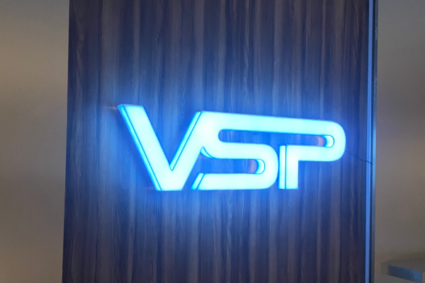 glowing blue letters on an internal reception wall