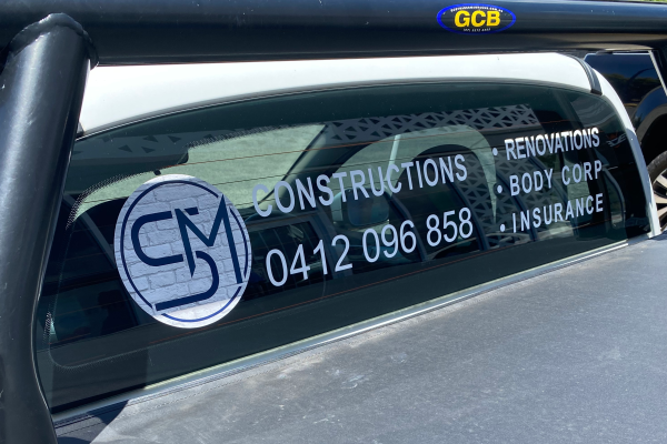 image of back window of a ute with white decals installed