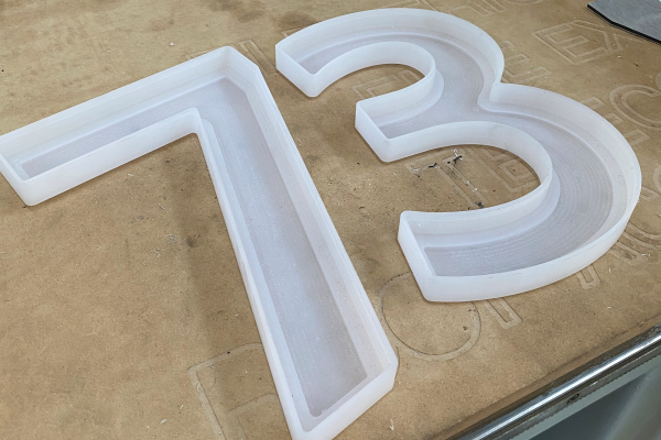 White fabricated 3D numbers 73