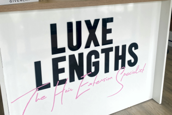 black 3D raised letters installed on front of business reception desk